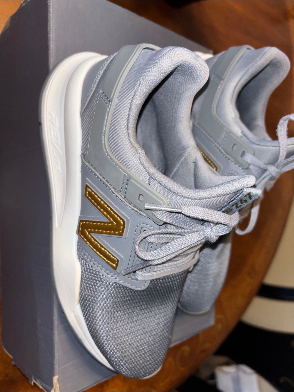 New Balance ,Womens Light Gray Athletic Sneakers with Gold Logo Accent
